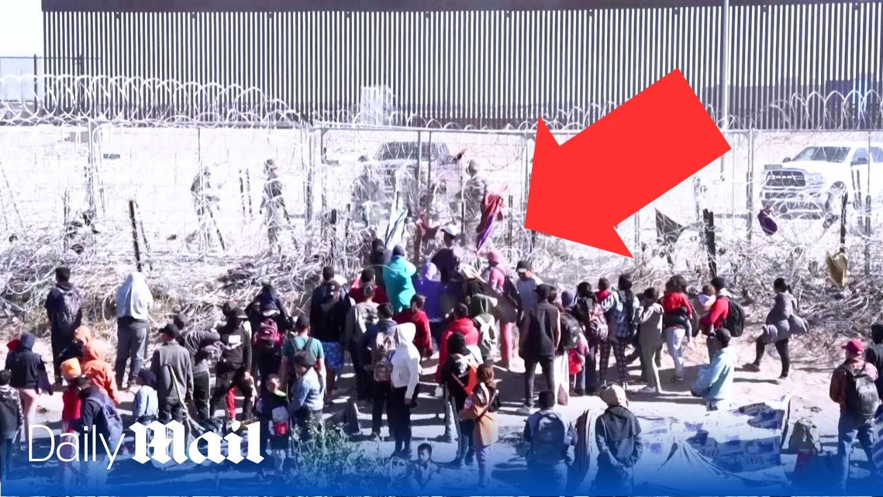 Hundreds of migrants breach southern US border fence in El Paso
