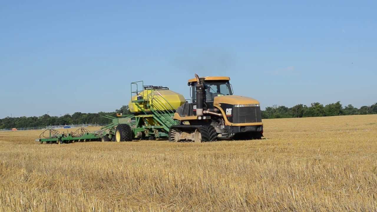 Caterpillar 65E with 1900 Seed Cart and 1850 Drill