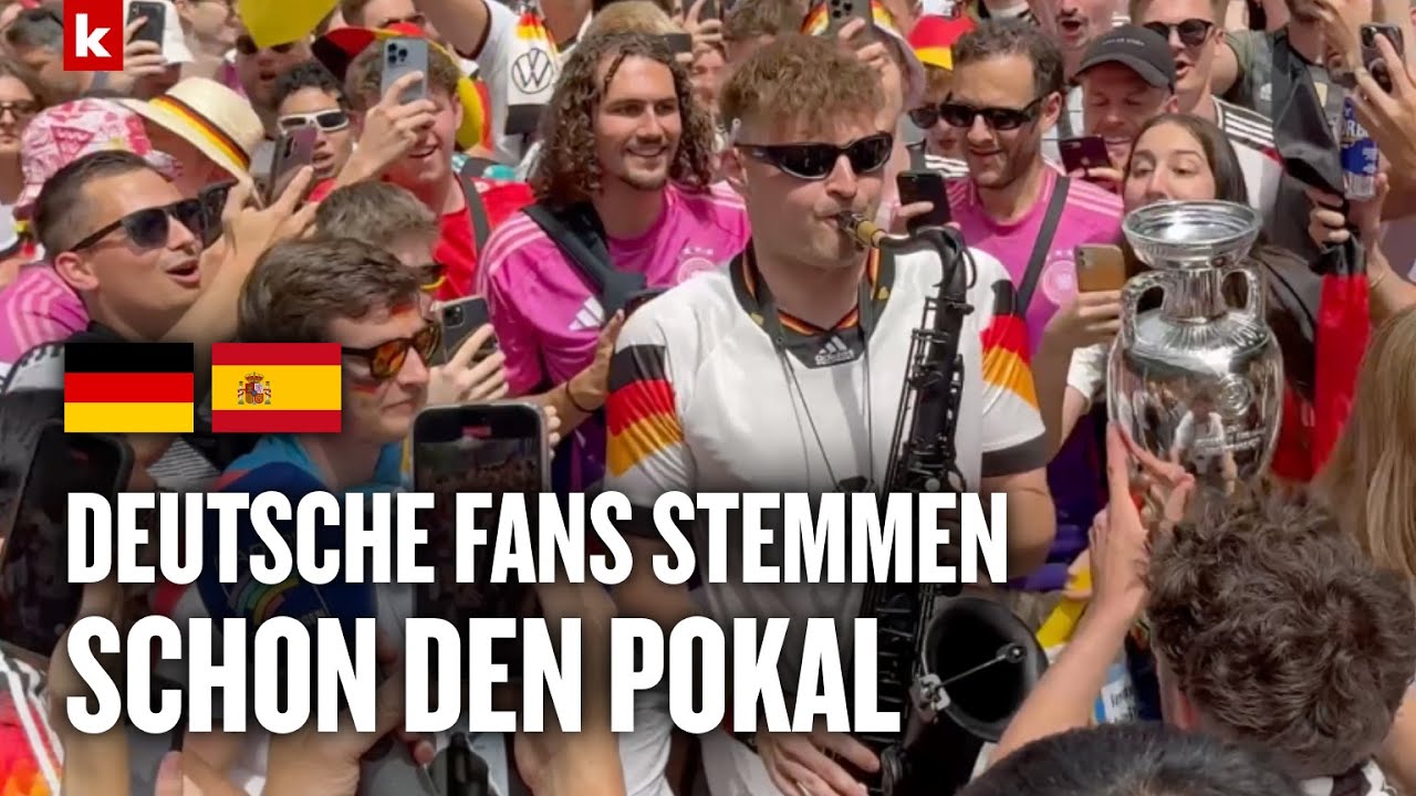 Deutsche Fans feiern schon mit dem Pokal - Saxophonist heizt der Menge ein | Deutschland - Spanien