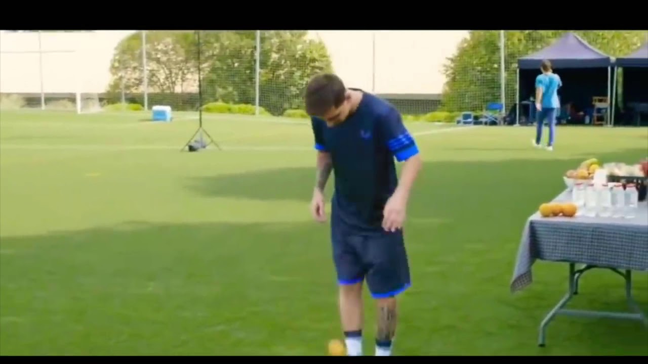 Messi - keepy uppy with an orange