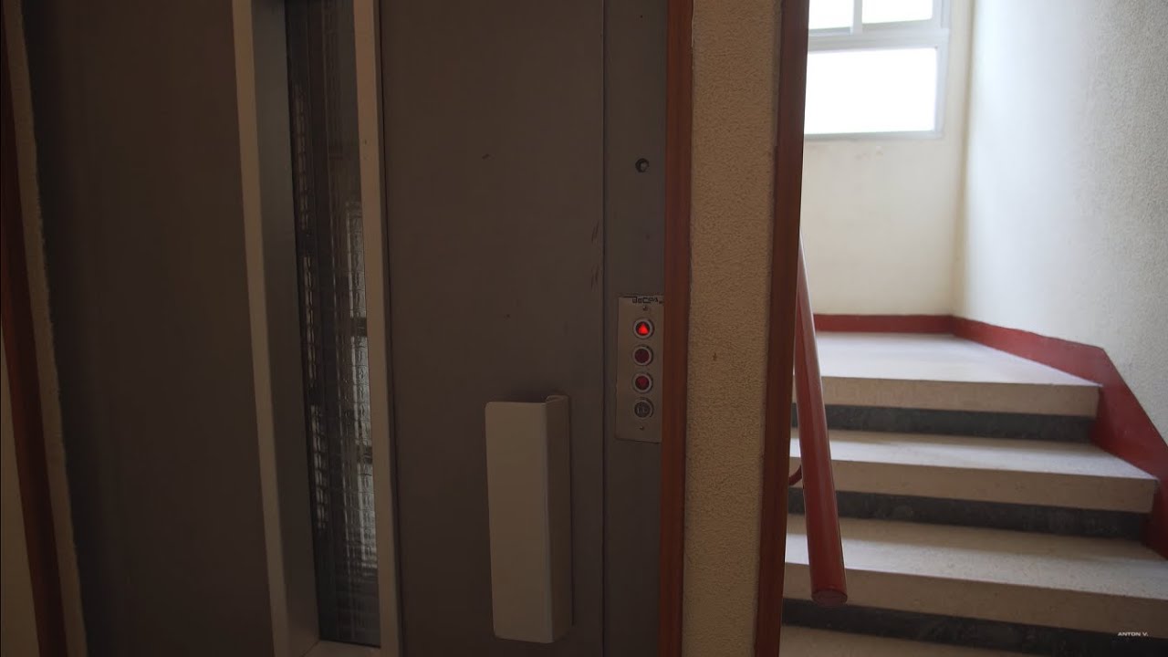 Spain, Madrid, Calle de Sancho Dávila 28, Thyssenkrupp elevator - going down + walk