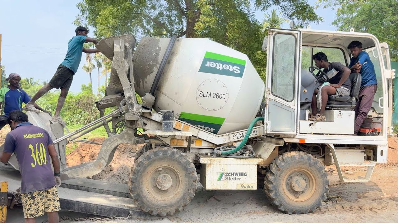 How it Works: Schwing Stetter Self-Loading Concrete Mixer in Action for Road Construction! 