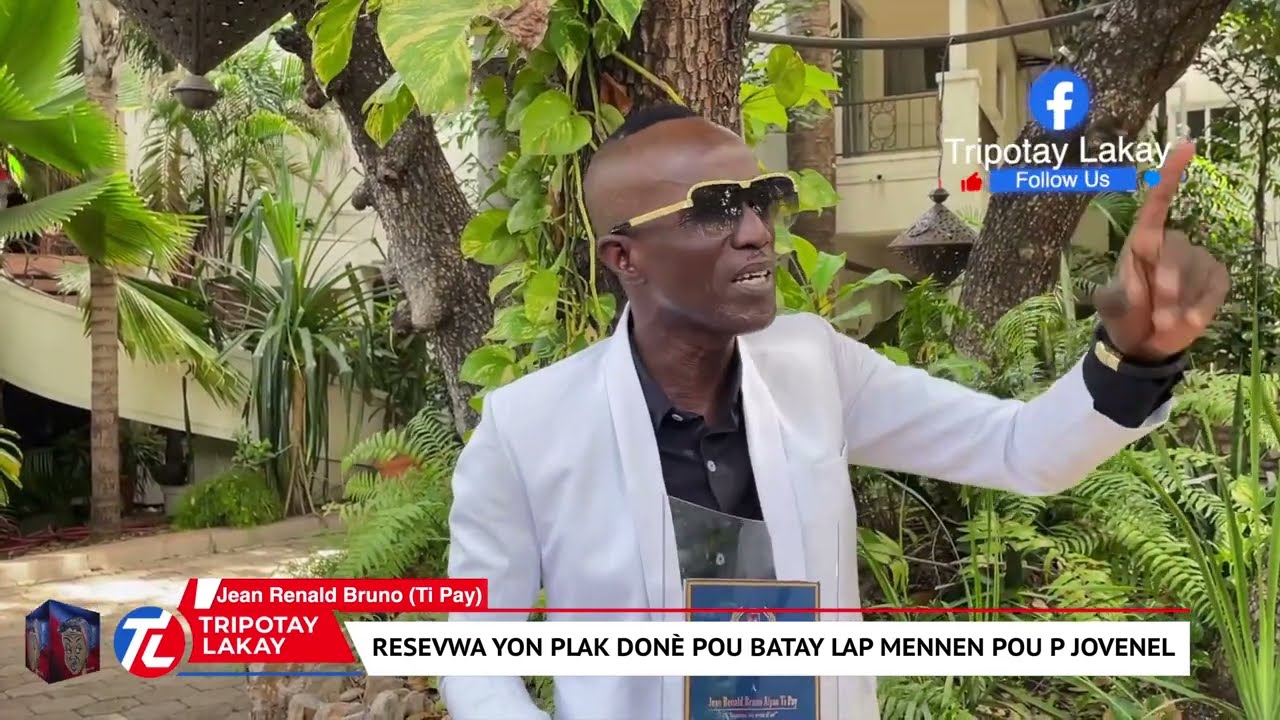 Atis Ti Pay (R&Egrave;V) resevwa yon plak don&egrave; nan men medya @MOUNAFEBON pou Jistis lap mande pou Jovenel