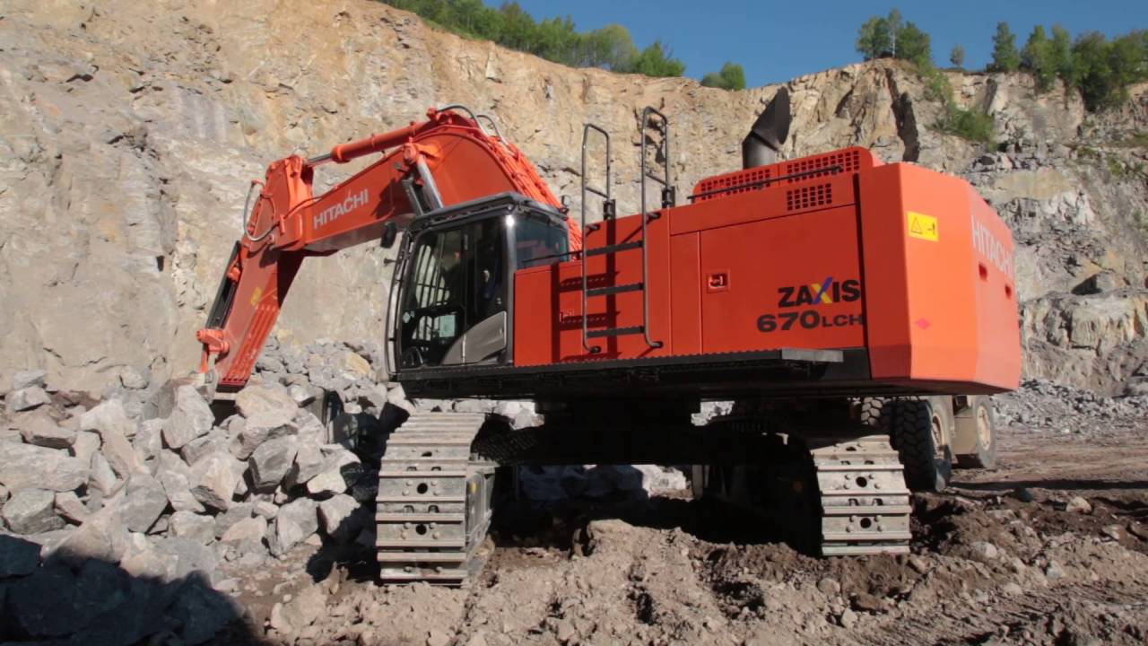 HITACHI ZX670LCH-5 loading a KOMATSU HD325 in a quarry