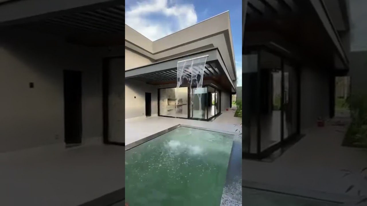 Piscina com cascata embutida em pergolado @progecao