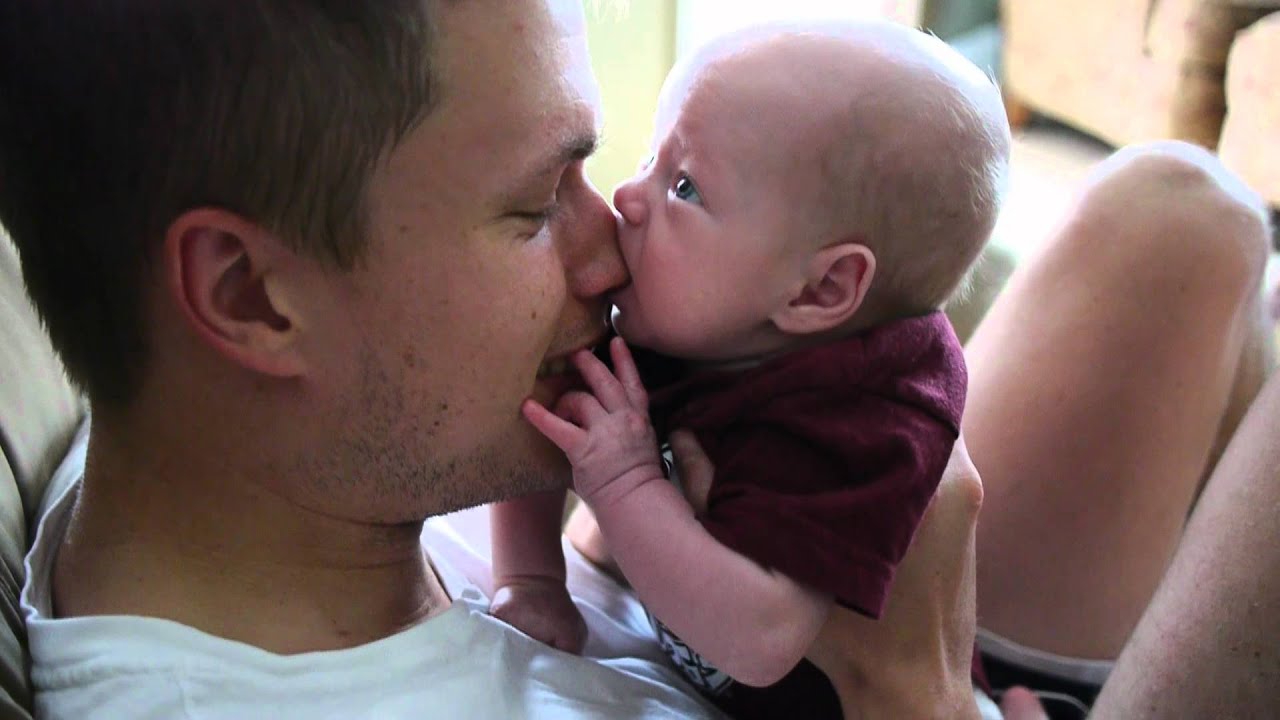 Hungry baby tries to eat nose