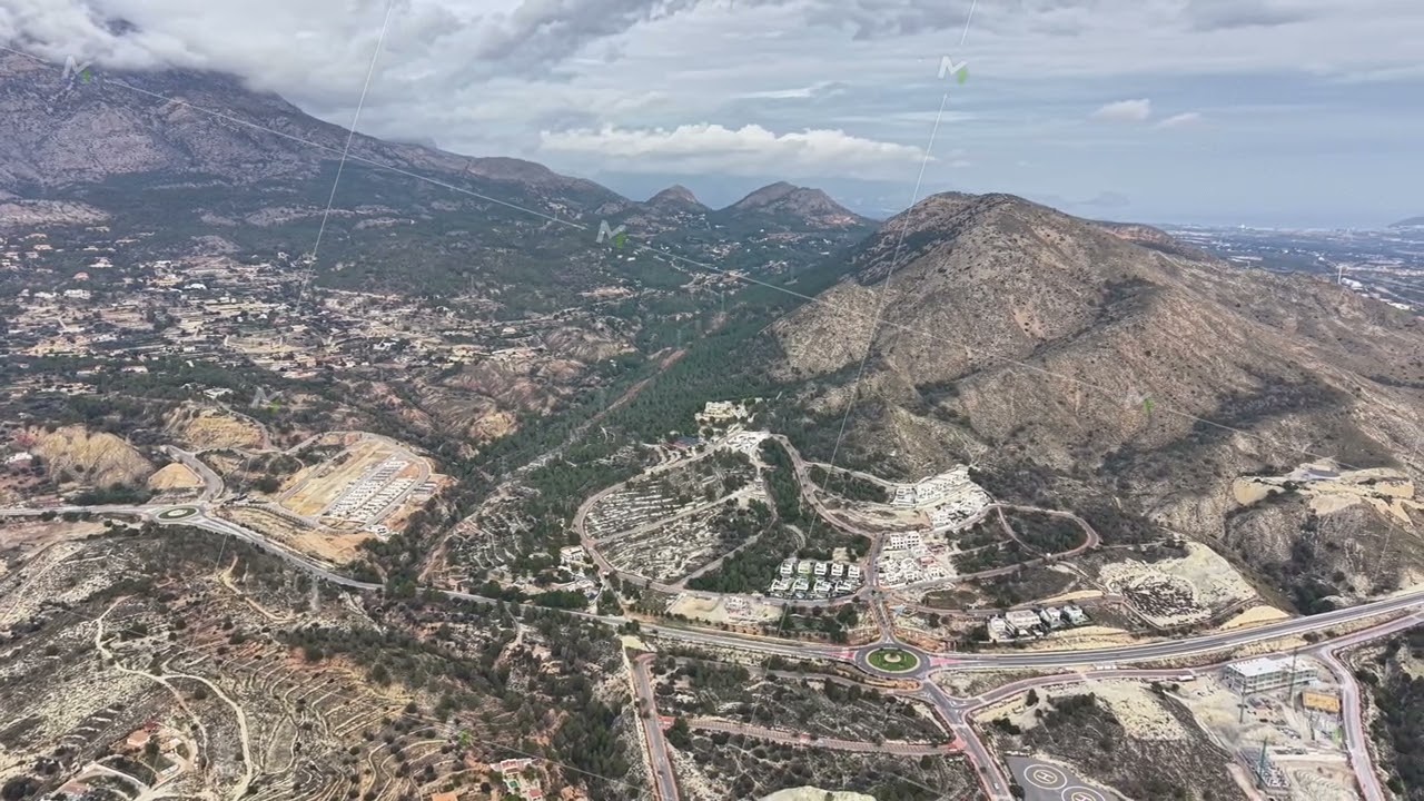 Mountain Settlement With Infrastructure, Aerial View Of Mountain Town Showcasing Roads And Housing