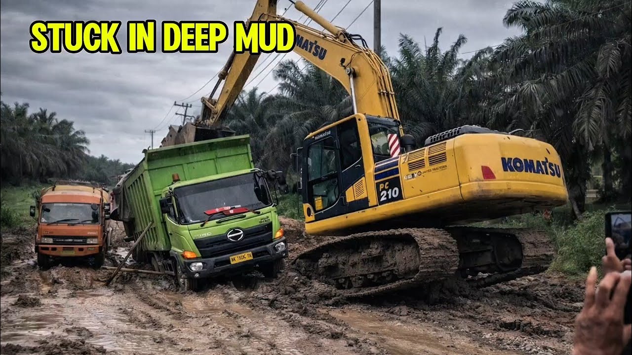 Extreme Mud Recovery: Komatsu Excavator Saves Stuck Dump Truck