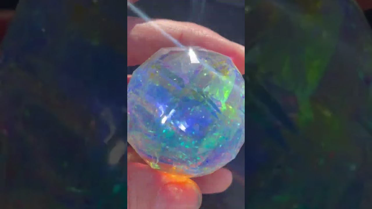Cold worked dichro sphere made by me gronerglass. Faceted by @hashnustonesgems1471
