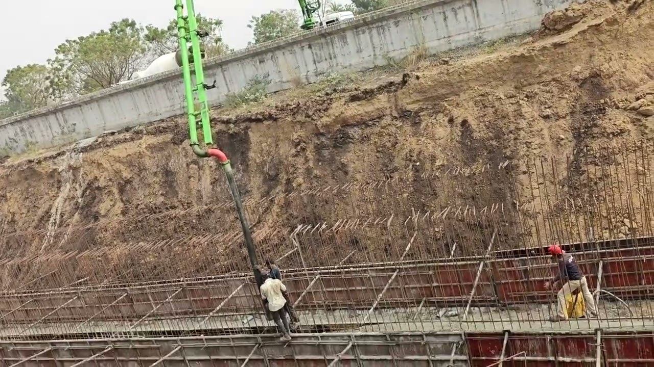 Rcc drain concrete pouring by boom placer At ADCL