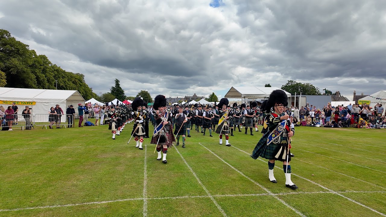 Scotland the Brave as Drum Majors lead the massed Pipes & Drums into 2024 Aboyne Highland Games
