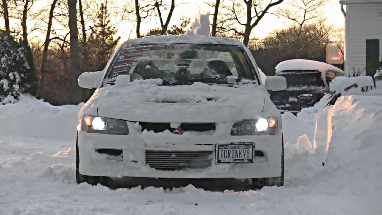 2 Evos and a GSX playing in the snow