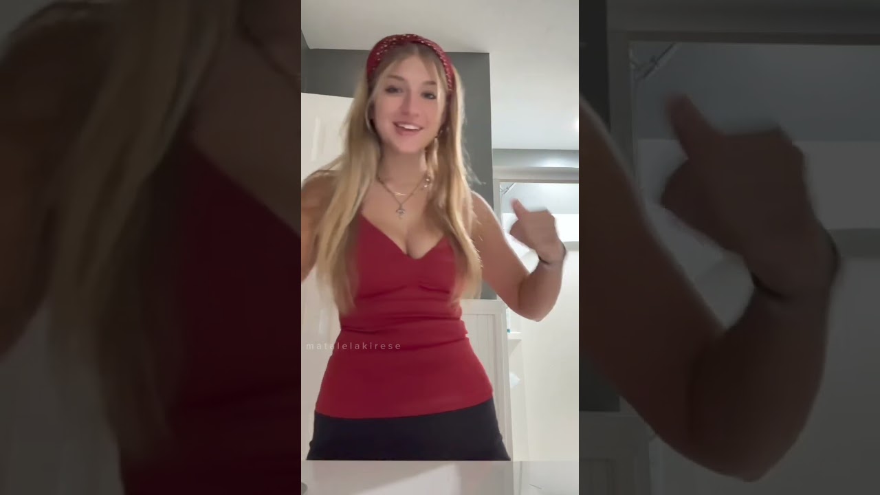 the one wearing the red dress is beautiful