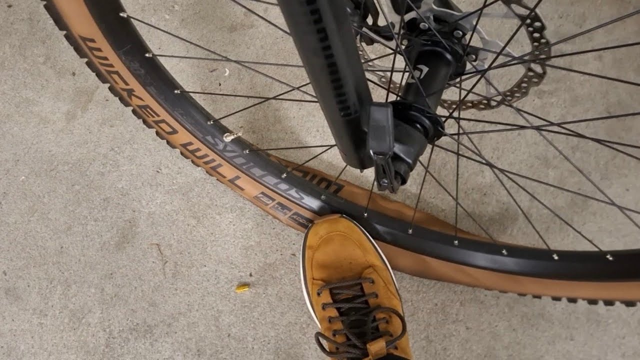 Deflate bike tire to play with him