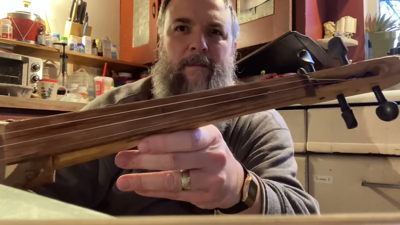 Gourd fiddle project part 5.  Synthetic core strings