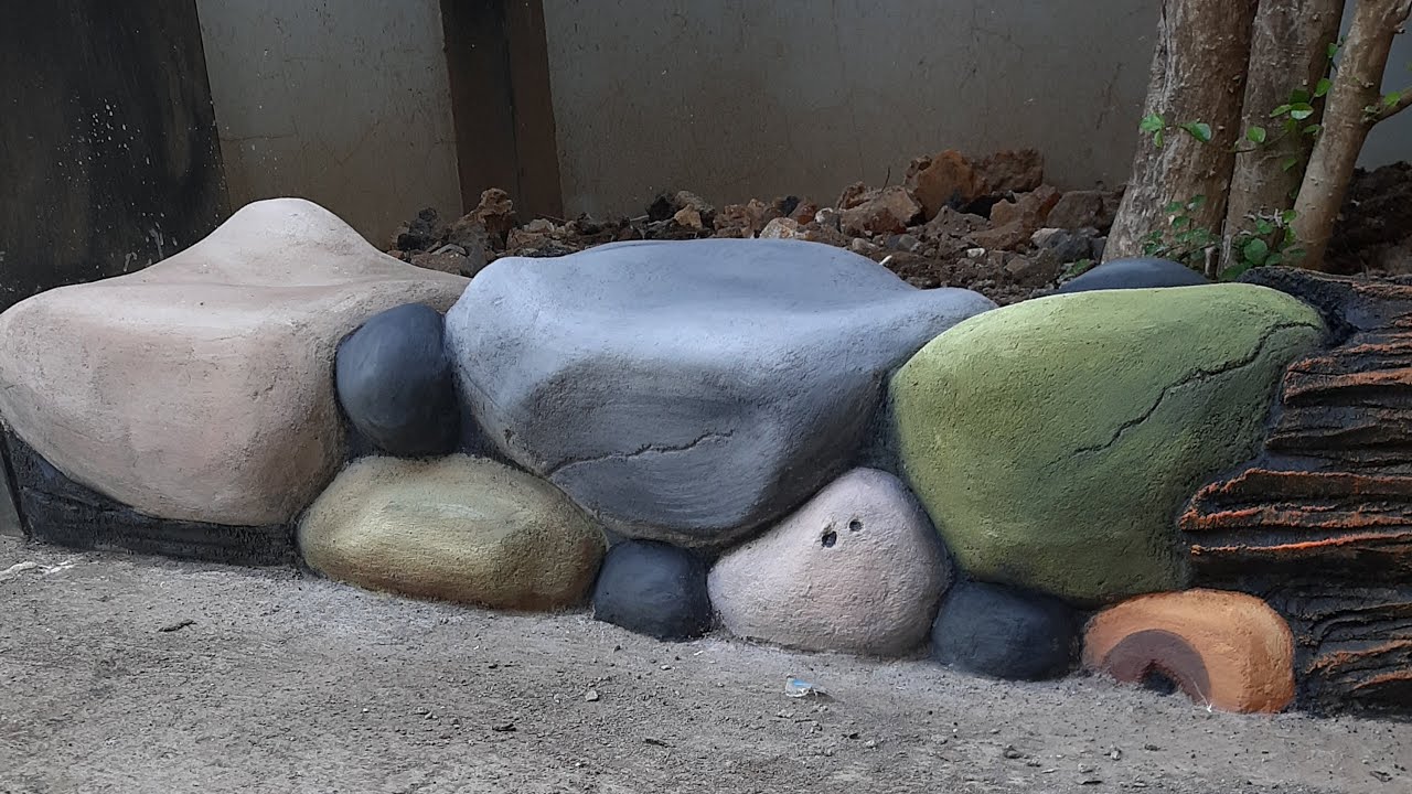 Proses pengecatan relief batu warna warni