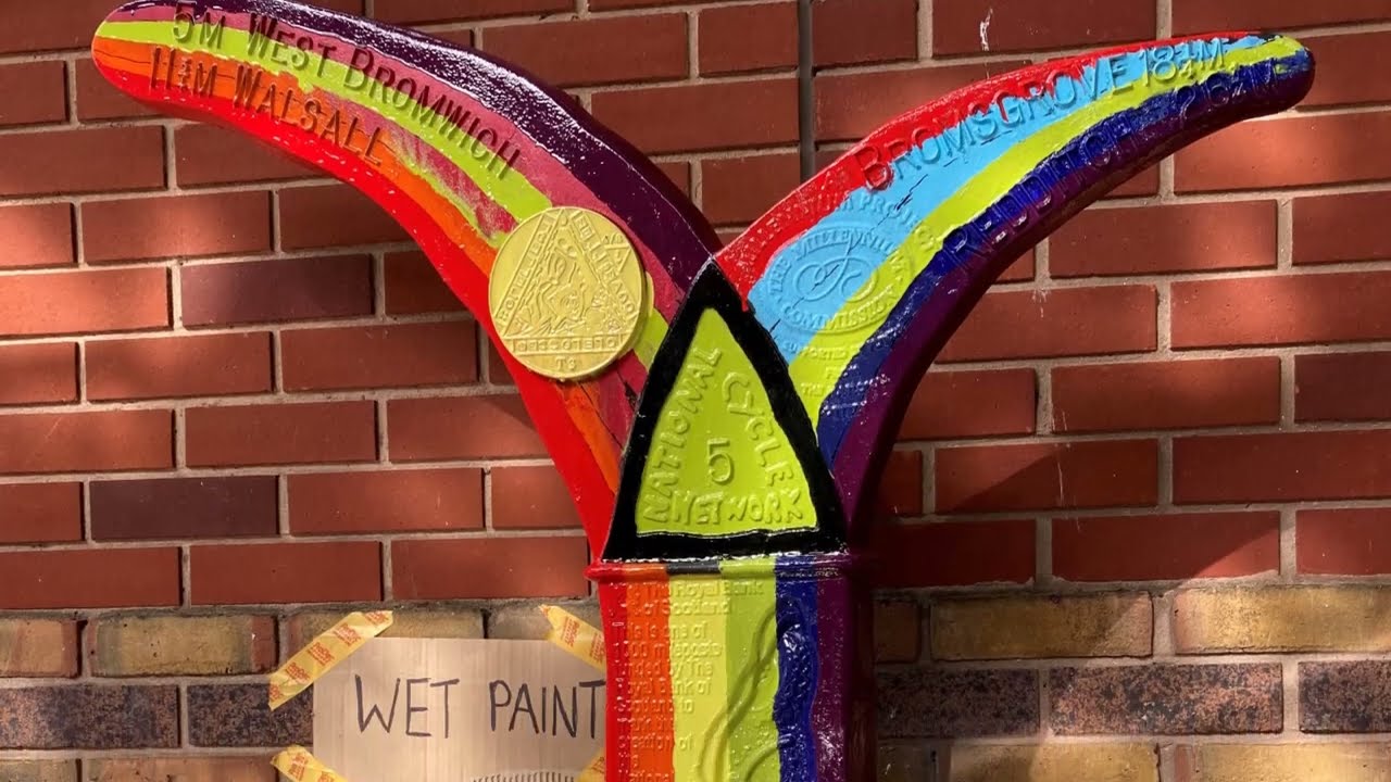 Painting Progress Pride mileposts on the National Cycle Network