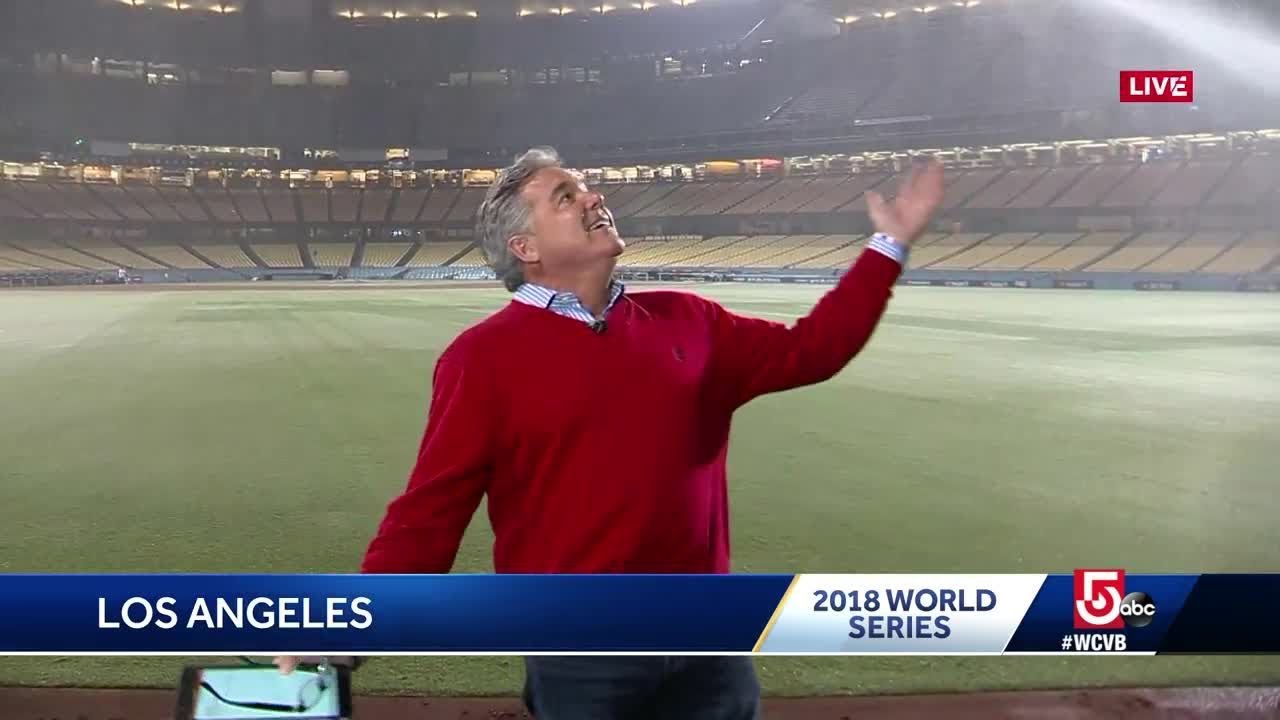 Doug Meehan gets soaked by sprinklers in Dodger Stadium