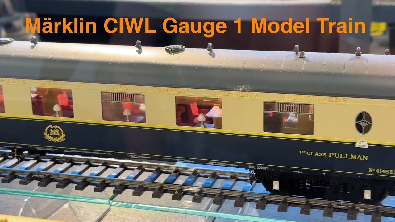 Marklin Edelweiss Pullman Express w/ French EST class 13 / 241 A model railway train and Red Arrow