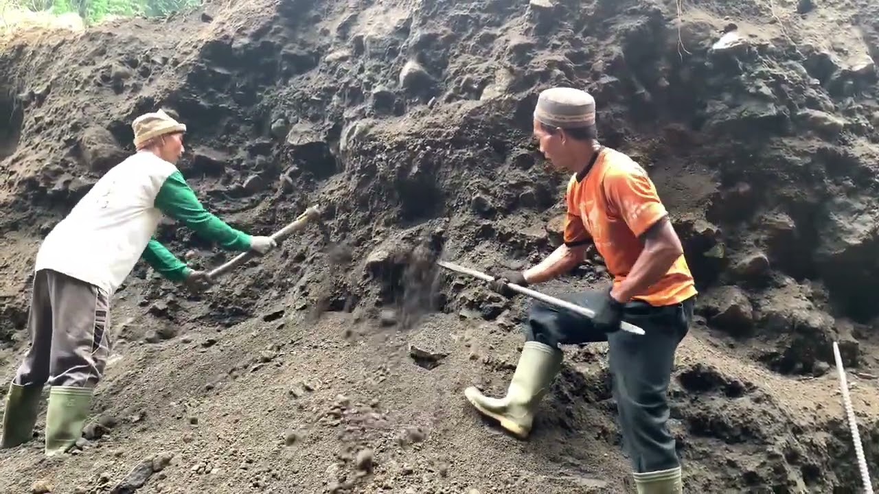 sand buried under giant rocks is very hard