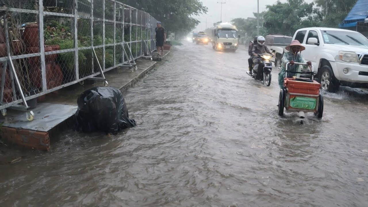 Floodwater flooded road after heavy rainstorm