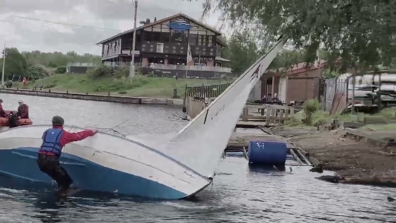 Manchester Seniors Sailing Club -  righting a capsized wayfarer dinghy.