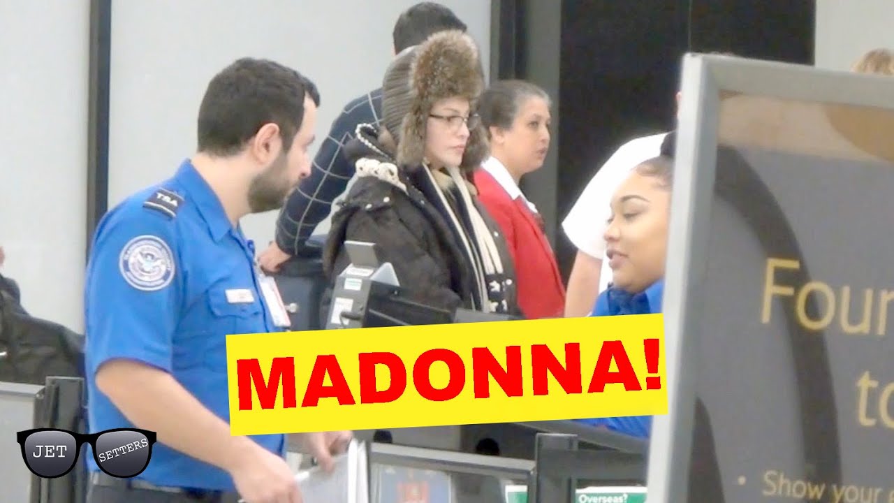 Madonna patiently waits in line at JFK airport