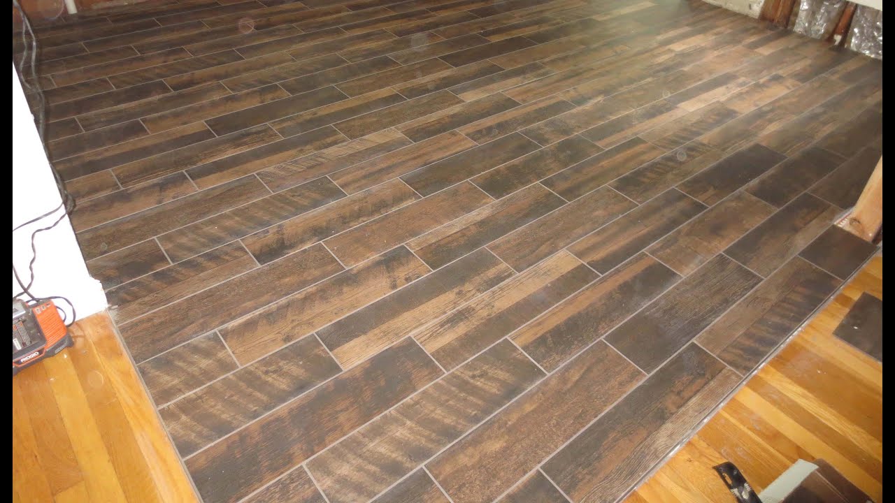 Wood look plank tile installation time lapse on Schluter Ditra with T-Lock™