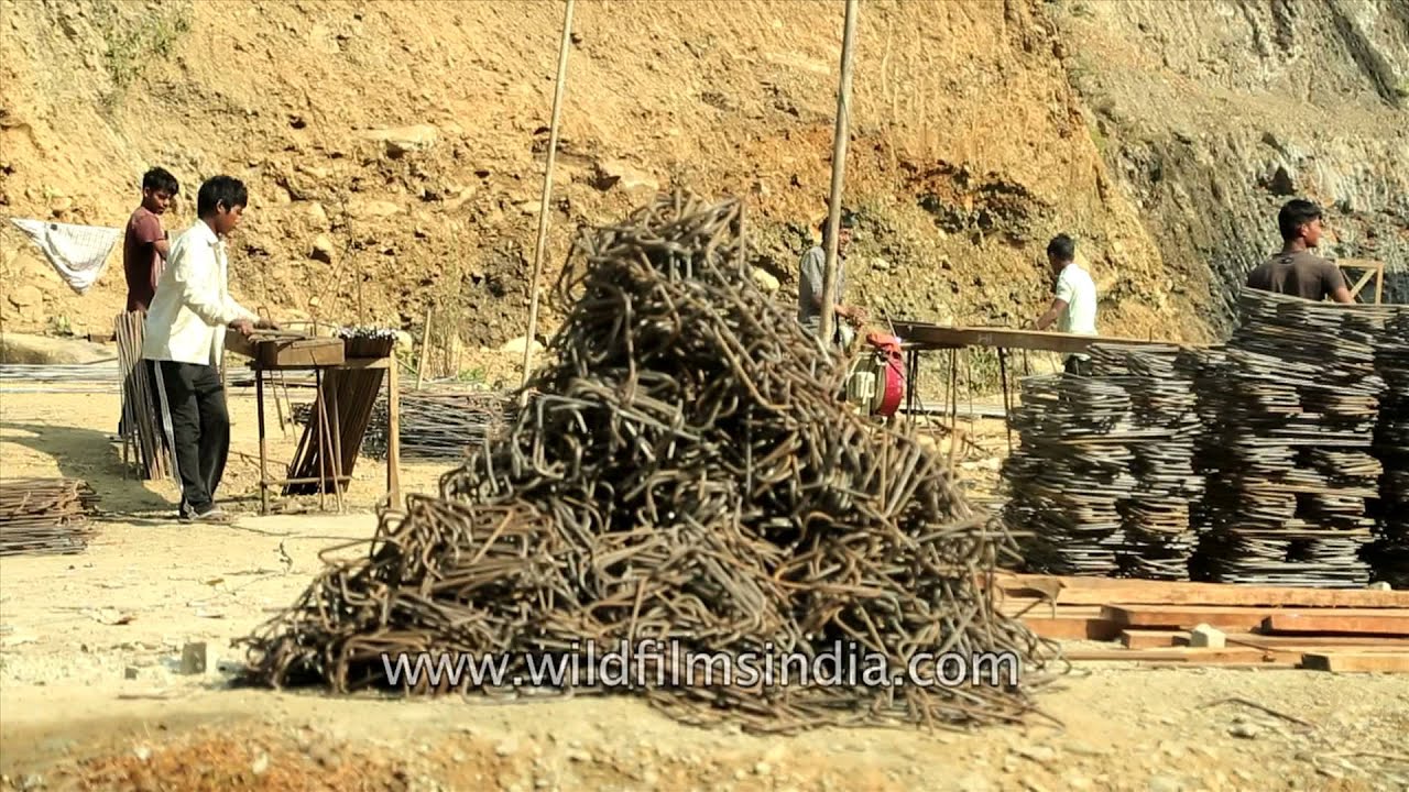 Indian labourers work on a railway construction site in Tamenglong, Manipur