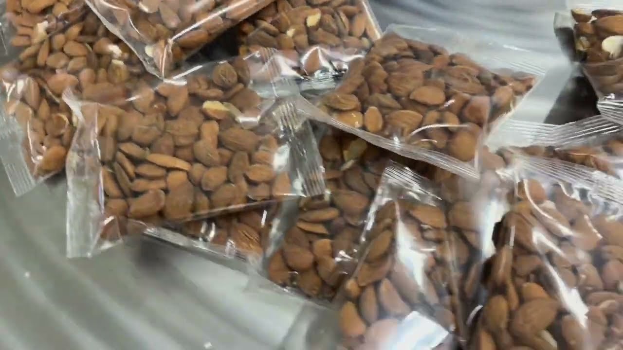 PACKAGING UNIT WITH MULTIHEAD FOR DRIED FRUITS  - Confezionatrice con multiteste per frutta secca