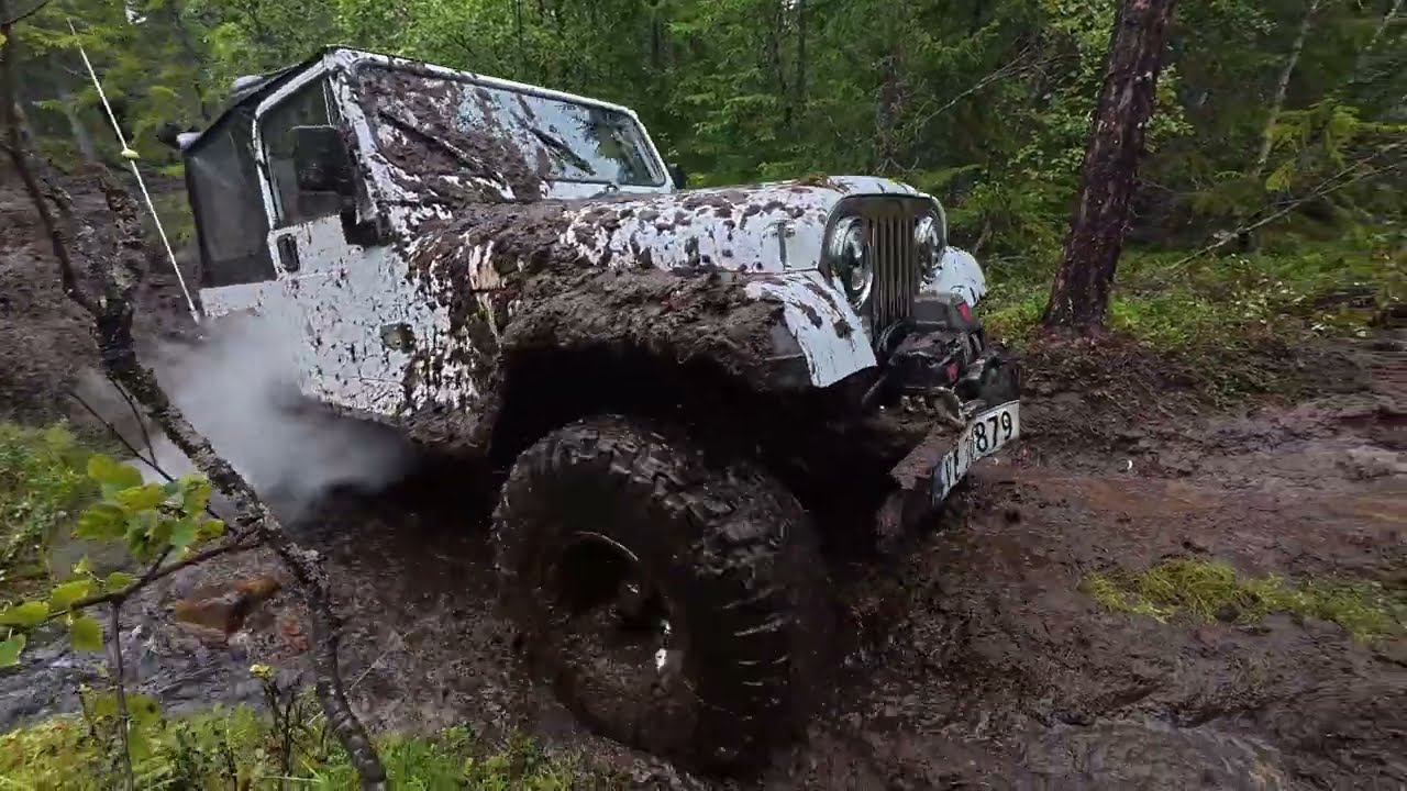 Mud offroading in the woods in Norway