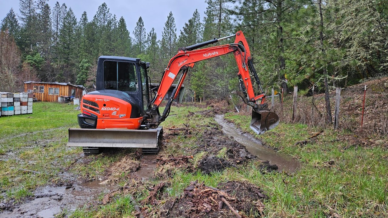 Flooding barn fix with the Kubota KX 040 4 excavator