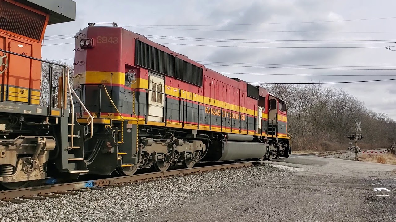KCS SD70MAC thundering across jointed rail with CF&E grain train