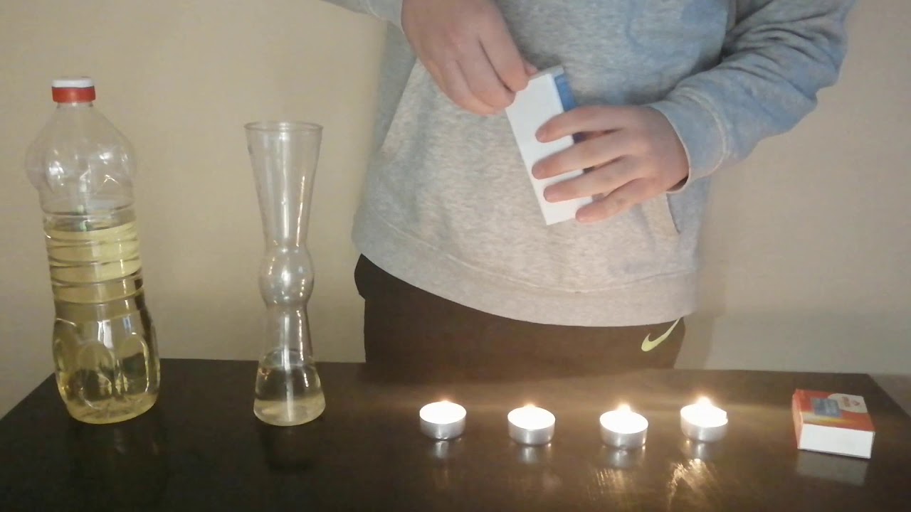 Apagando velas con CO2. Reacción entre vinagre y bicarbonato.