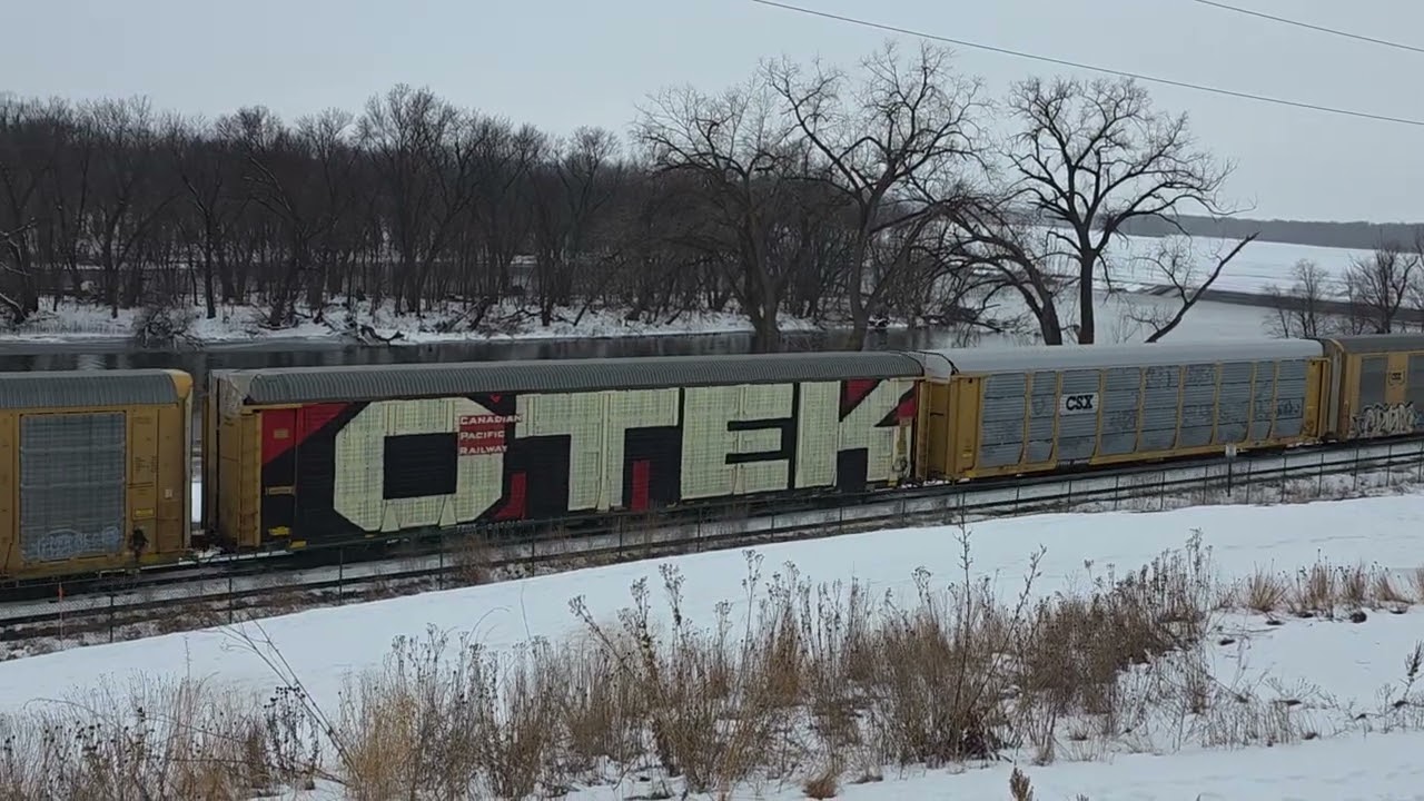 BNSF 6696 Auto rack train in the pouring sleet we had yesterday! I got soaked! Onalaska, Wi. 2/24/26