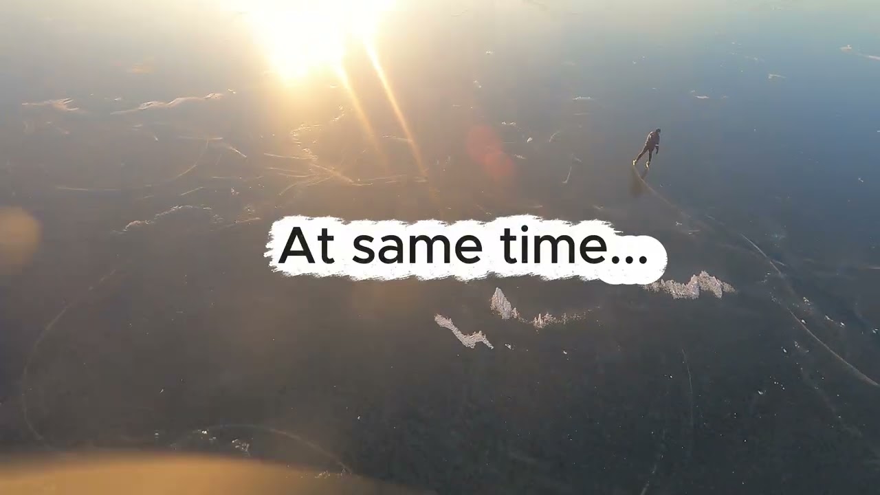 Winter on the Sõrve peninsula. Ice skating on frozen bay. Drone video