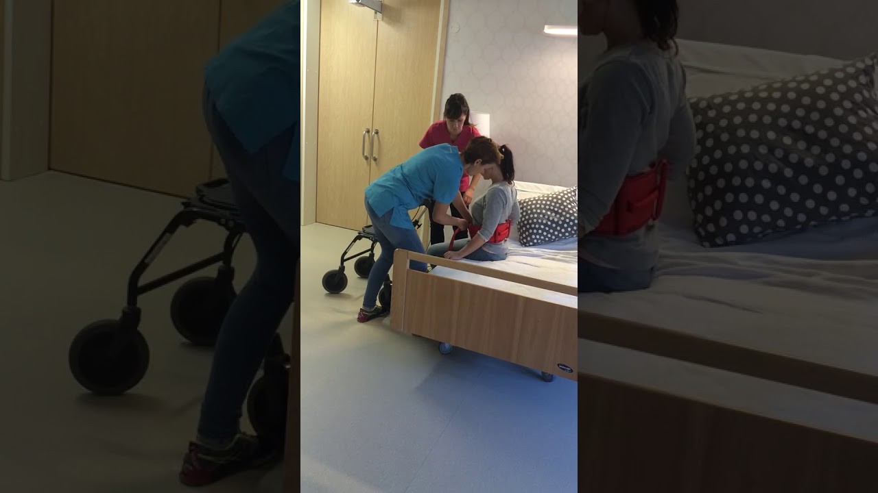 från sittande på sängkant till stående med rollator  vårdbälte och två personal  1