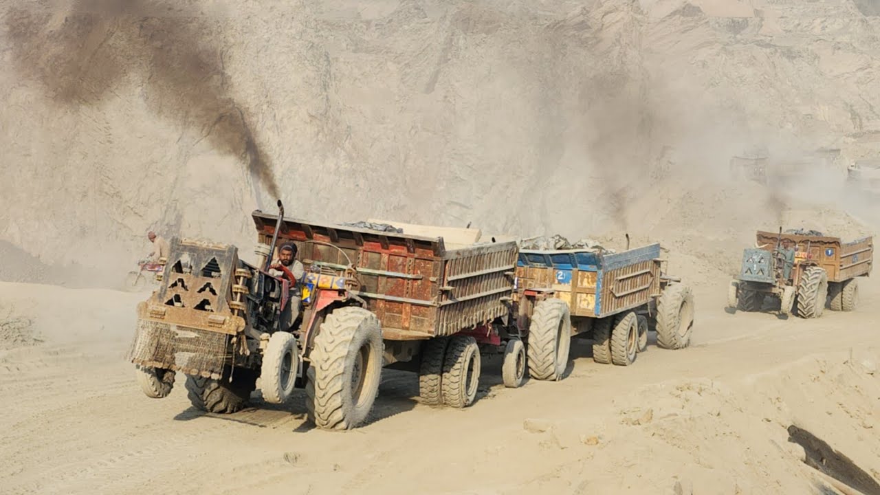 Massive Rock Transport: Mining Trucks & Tractors Journey to the Crusher Plant! 🚜🪨