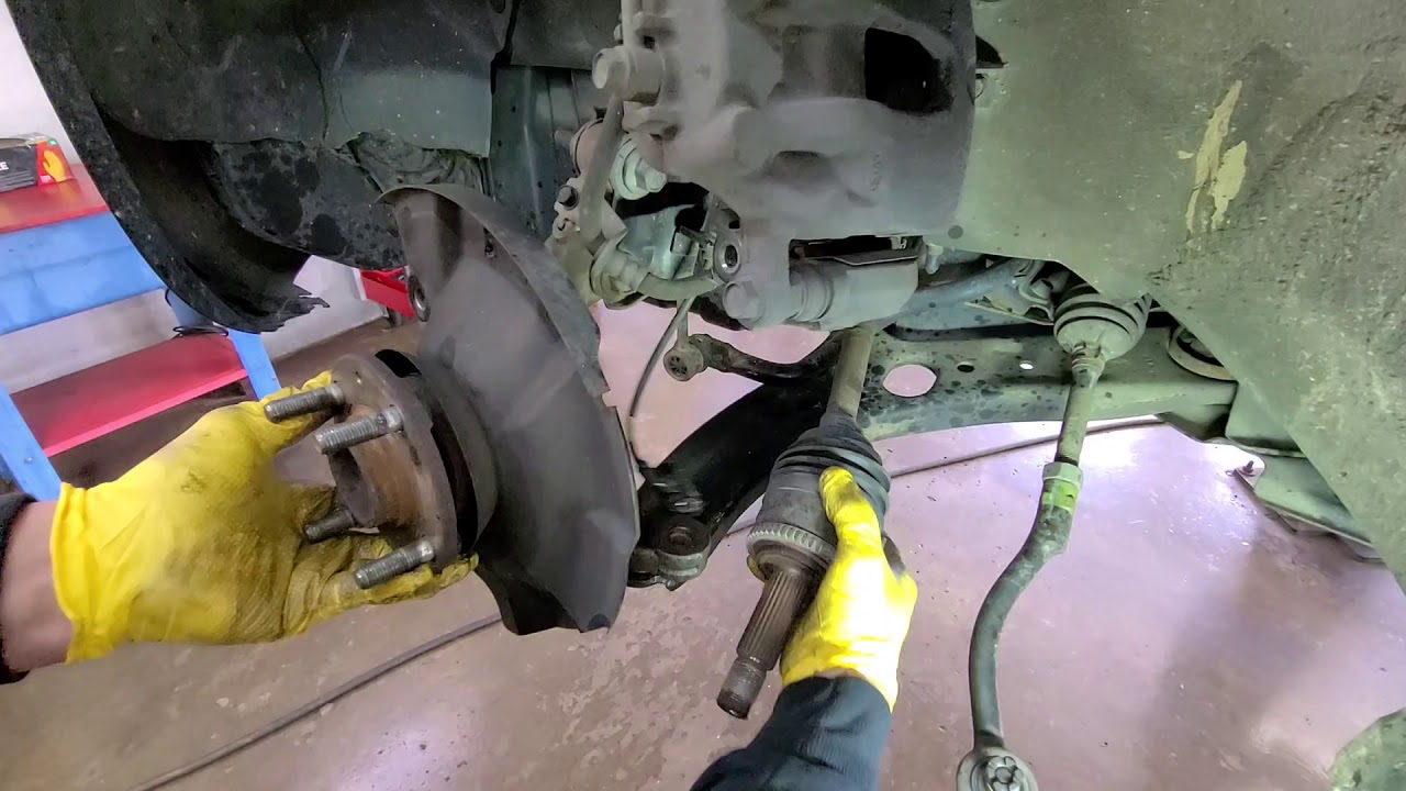 2013 Kia Rio. press in bearing on vehicle.
