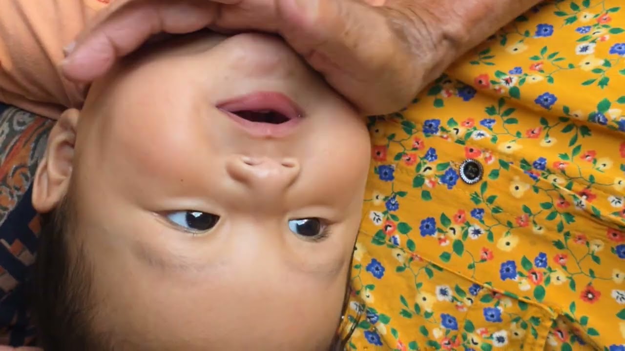 Peaceful Kid Playing  With Mom and Grandma.
