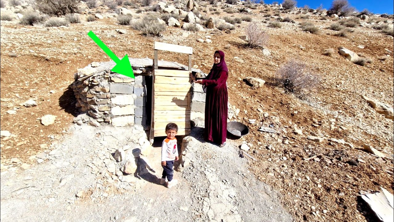 Homeless mother in the mountains; building a wooden door for a cave with her bare hands