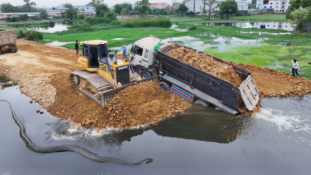 OMG!! Unbelievable! 25.5 ton heavy truck overturns and falls into water, helped by Dozer & Excavator