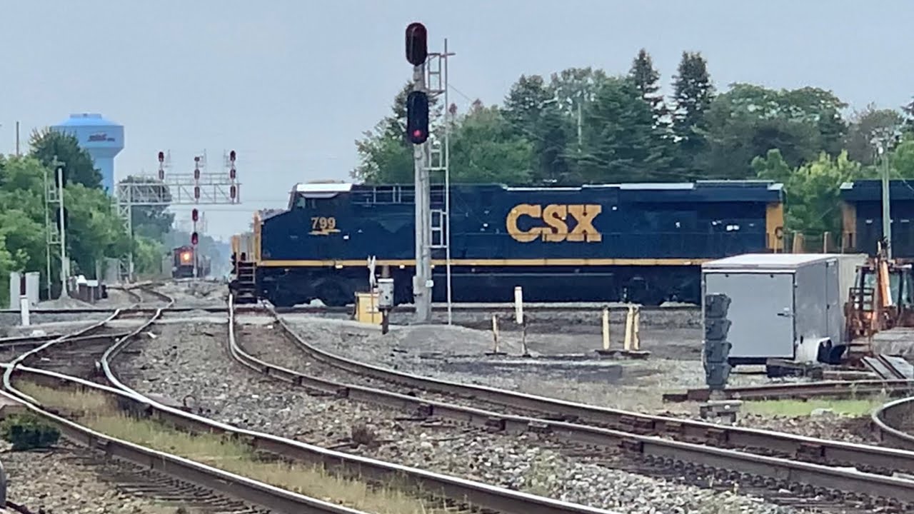 2 Trains Passing Over Fostoria RR Diamonds, Old Locomotives Roar Over Diamonds With Steel Coil Train