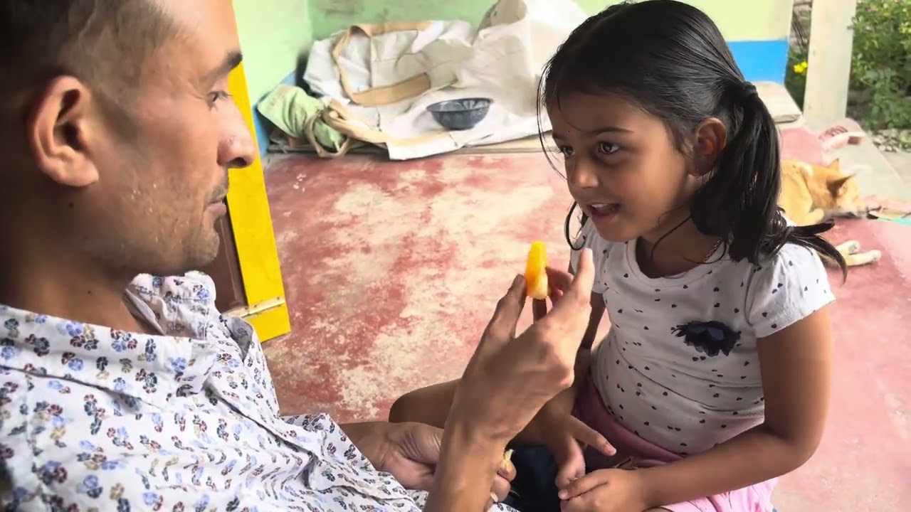Father daughter time 💕 her favourite orange 🍊 care , love ❤️ #dailyvlog #villagerlifestyle