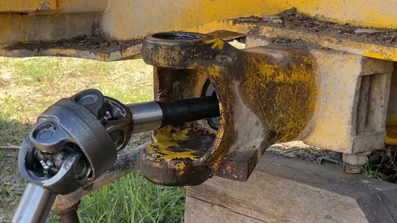 Backhoe rear axle shaft replacement