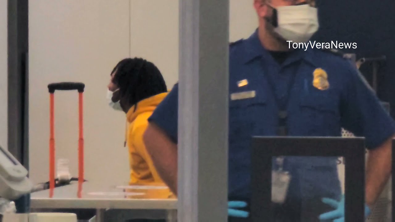 Man  Arrested by LAXPD at tsa checkpoint with a Loaded Firearm 9MM Glock in carry on bag
