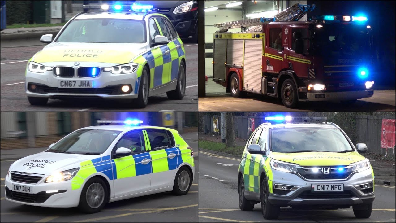 Fire Engine, Police Cars and Ambulances responding with siren and lights in Wales