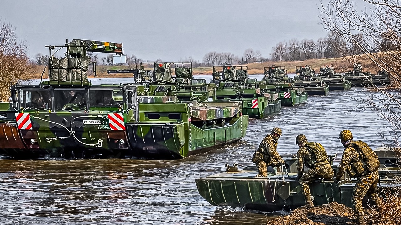 War Machines Cross the River as Troops Build Amphibious Bridges Under Pressure