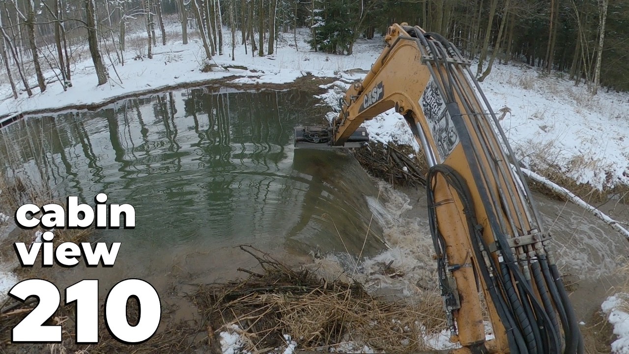 Removing A Beaver Dam In Winter With Excavator No.210 - Cabin View