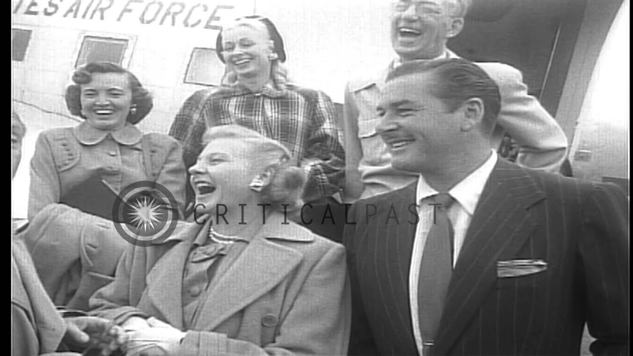 Jack Benny, Errol Flynn, and others bid goodbye before boarding a US Air Force C-...HD Stock Footage